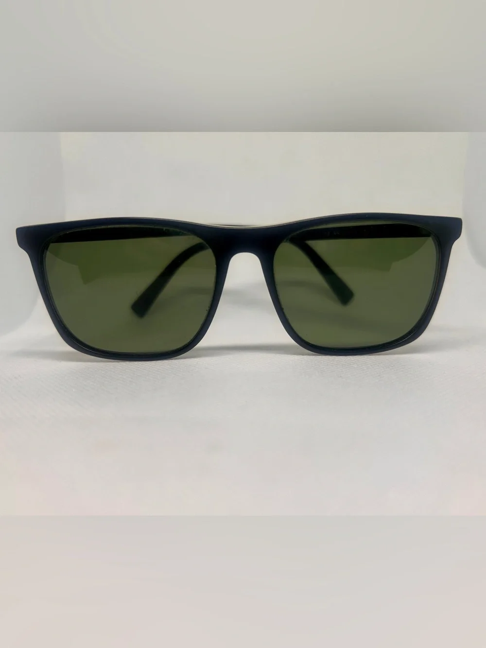 Warby Parker’s Fletcher Black Sunglasses with Green Lenses